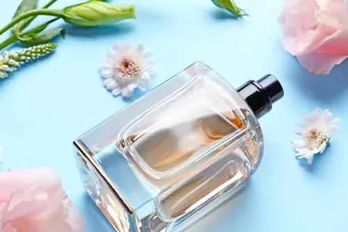 A perfume bottle among spring blossom
