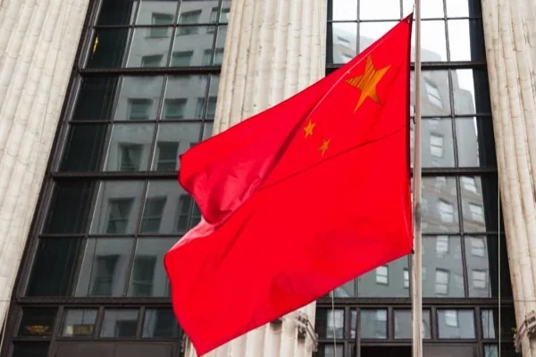 The flag of China flying outside a government building